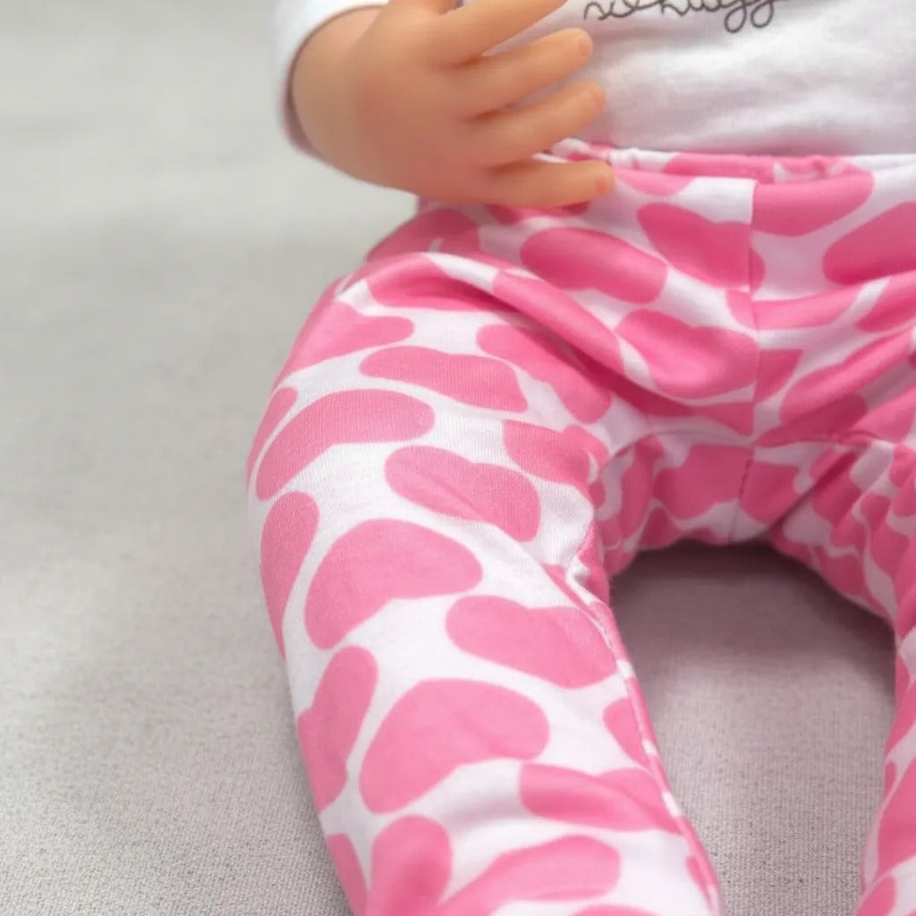 Bebé Reborn realista con ropita rosada - Mide 55cms y pesa 1200g